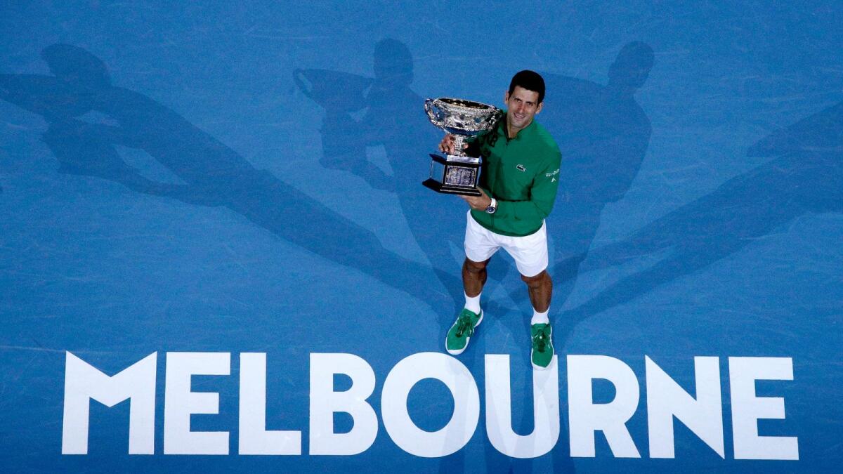 FILE - In this Feb. 3, 2020, file photo, Serbia's Novak Djokovic holds the Norman Brookes Challenge Cup after defeating Austria's Dominic Thiem in the men's singles final of the Australian Open tennis championship in Melbourne, Australia. Photo: AP