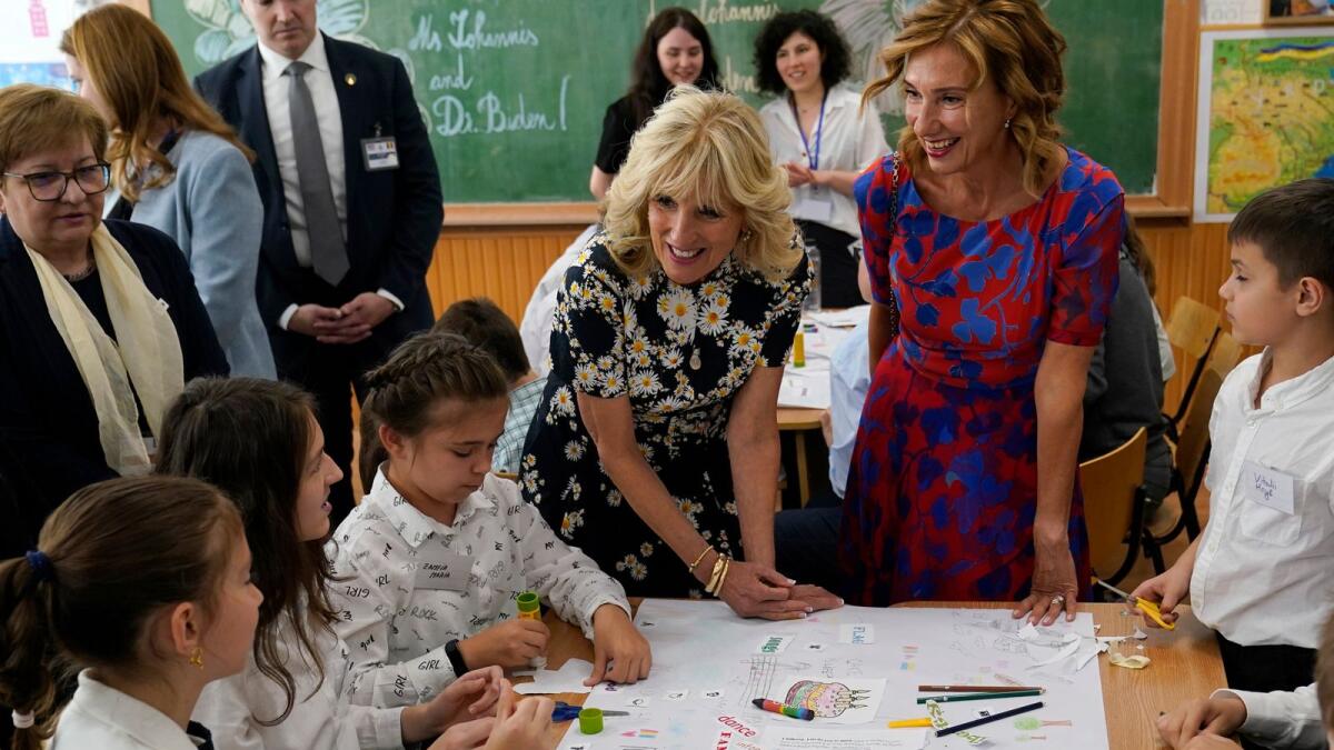 US First Lady Jill Biden and First Lady of Romania Carmen Iohannis visit the ?coala Gimnaziala Uruguay, or Uruguay School, in Bucharest, Romania, on May 7, 2022. AFP