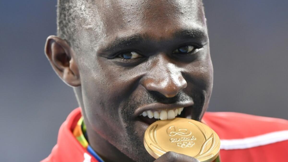 David Rudisha with his 800m gold medal at the 2016 Rio Olympics. - AFP file