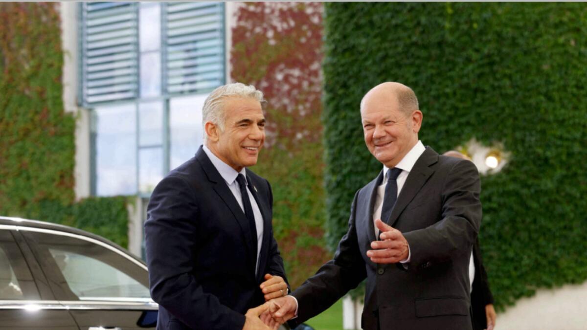 German Chancellor Olaf Scholz (R) welcomes Israeli Prime Minister Yair Lapid in Berlin. — AFP