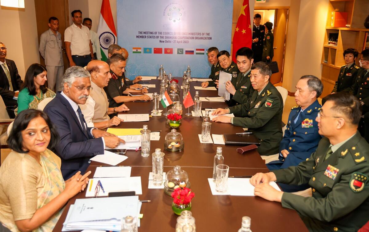 Indian Defence Minister Rajnath Singh, seated third left, attends a meeting with his Chinese counterpart Li Shangfu, third right, during the Shanghai Cooperation Organization Defence Minister's Meeting in New Delhi, India, on Thursday. — AP