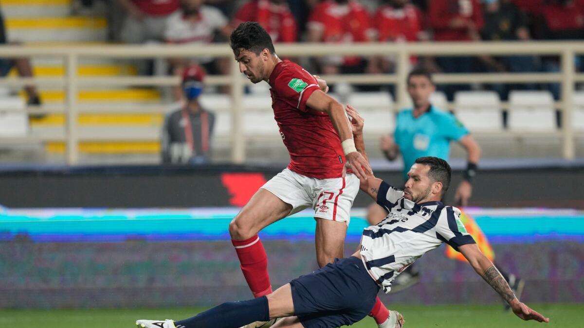 Al Ahly's Taher Mohamed (left) is challenged by Monterrey's Celso Ortiz on Saturday. — AP