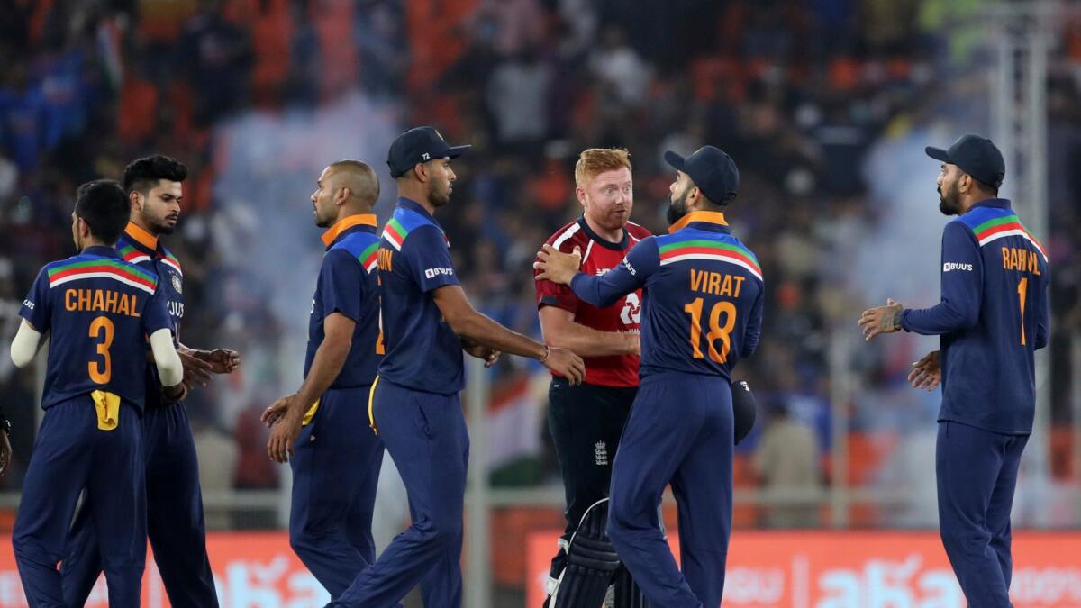 England's Jonny Bairstow (third right) shakes hands with India's captain Virat Kohli after  the first Twenty20  match in Ahmedabad.— AP