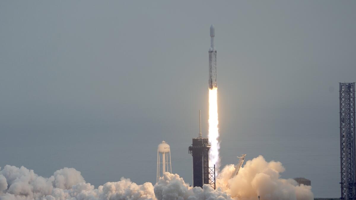 A SpaceX Falcon Heavy rocket lifts off from Launch Pad 39A at the Kennedy Space Center in Cape Canaveral. — AP