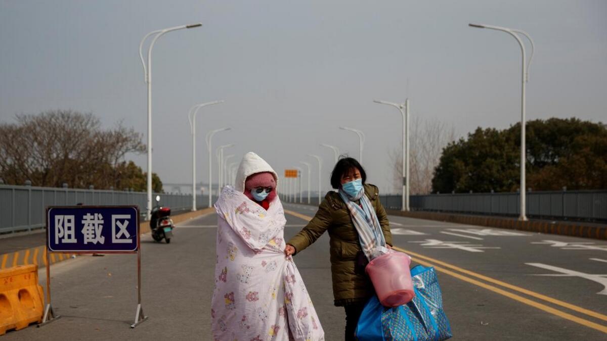 Lu, a farmer from a village on the Hubei province side of the bridge, was trying to gain passage for her daughter, 26-year-old Hu Ping, who has leukemia. She has been unable to receive a second round of chemotherapy treatment in the overwhelmed hospitals of provincial capital Wuhan, the epicenter of the virus outbreak.