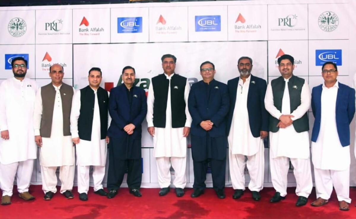 Muhammad Akhtar Javed, Executive Director of the State Bank of Pakistan; Zulfikar Ali Khokhar, Head of the Pakistan Remittance Initiative at the State Bank of Pakistan, along with the Bank Alfalah team. — Supplied photo