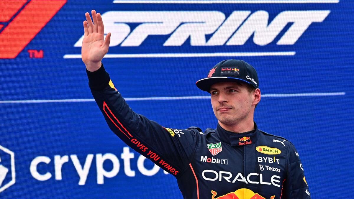 Red Bull Racing's Dutch driver Max Verstappen waves as he celebrates winning pole position in the sprint. (AFP)