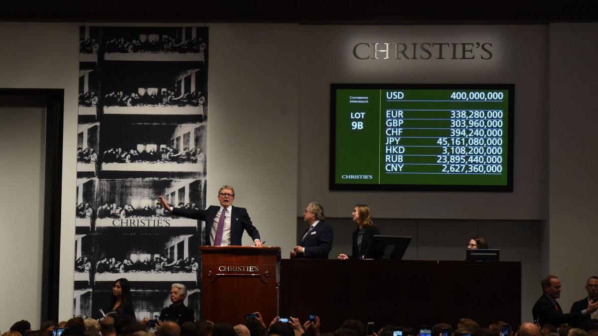Auctioneer Jussi Pylkkanen signalling the final auction bid for Leonardo da Vinci’s 'Salvator Mundi' at Christie's New York in 2017. Photo: AFP