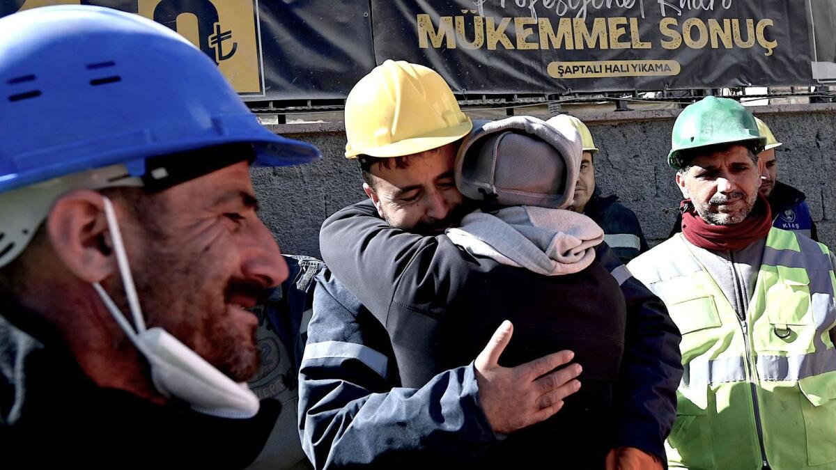 The uncle of Aleyna Olmez, centre, reacts after his 17-year-old niece was rescued from a collapsed building, 248 hours after the 7.8-magnitude earthquake which struck parts of Turkey and Syria, in Kahramanmaras on Thursday. — AFP