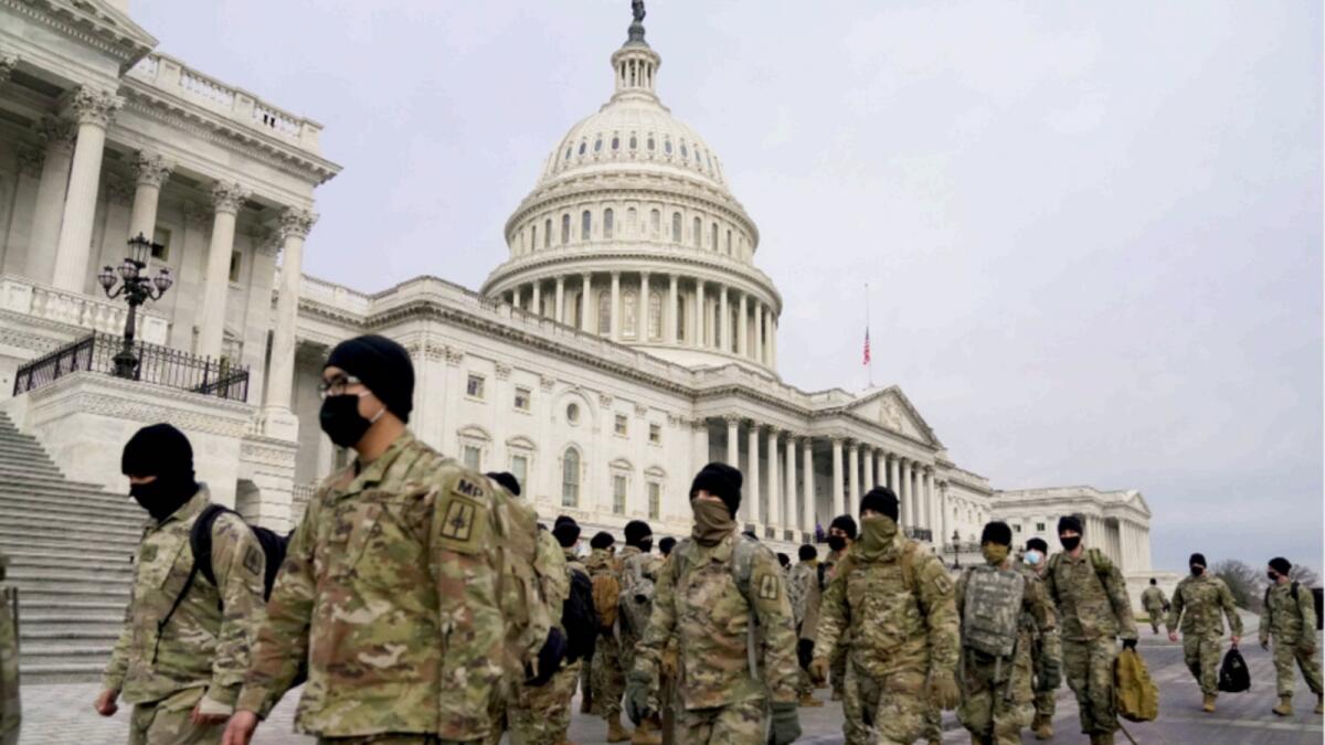 Members of the  National Guard arrive to the US Capitol in Washington on Monday. — Reuters