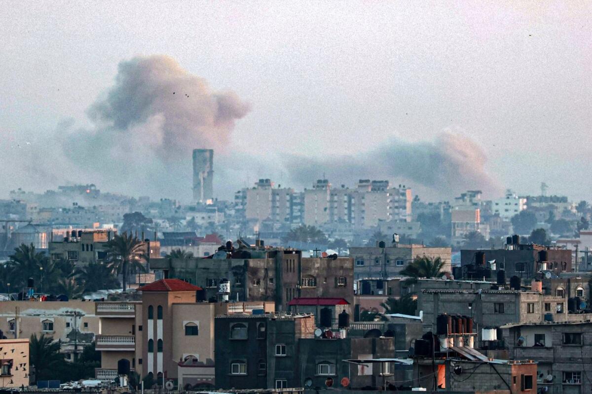 This photograph taken from Rafah shows smoke billowing over Khan Yunis in the southern Gaza Strip during Israeli bombardment on Tuesday. — AFP
