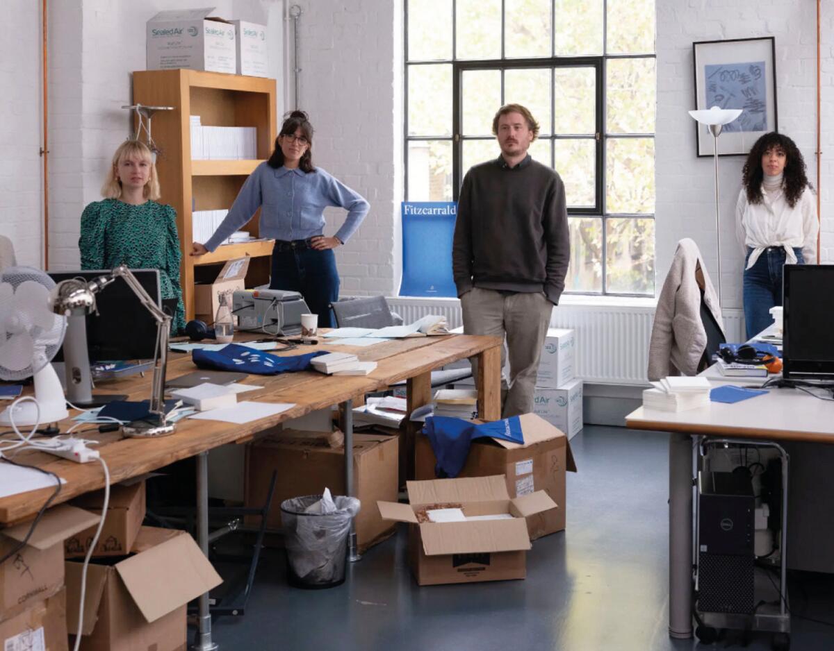 From left: Rosie Brown, Tamara Sampey-Jawad, Jacques Testard and Joely Day in Fitzcarraldo’s one-room office in London. — (Kalpesh Lathigra for The New York Times)