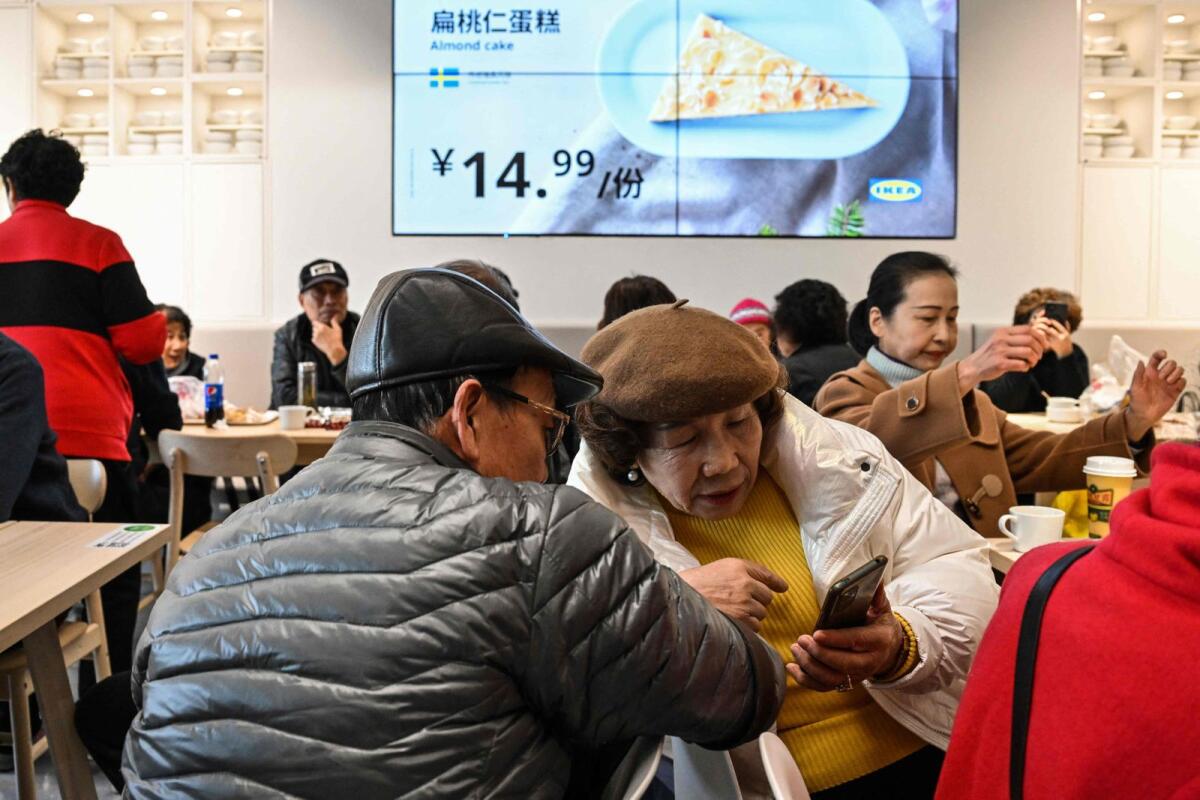 Ederly people at the Ikea restaurant, where they meet every Tuesday, in the Xuhui district in Shanghai. — AFP