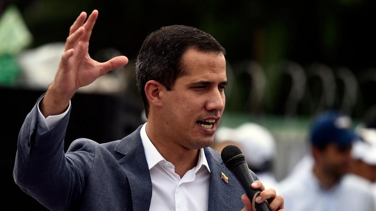 Venezuelan opposition leader and self-proclaimed acting president Juan Guaido addresses supporters during a rally, as part of the 'Operation Freedom', in Chacaito, Caracas, Venezuela.- AFP