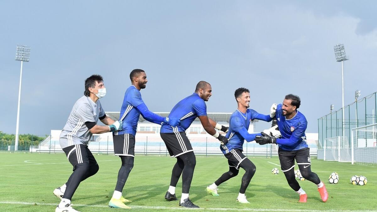 TEAM BONDING: UAE goalkeepers (from right) Khaled Al Senani, Mohammed Al Shamsi, Ali Khaseif, Khalid Eisa and goalkeeping coach Eduardo Nino enjoy a lighter moment during training. - Supplied photo