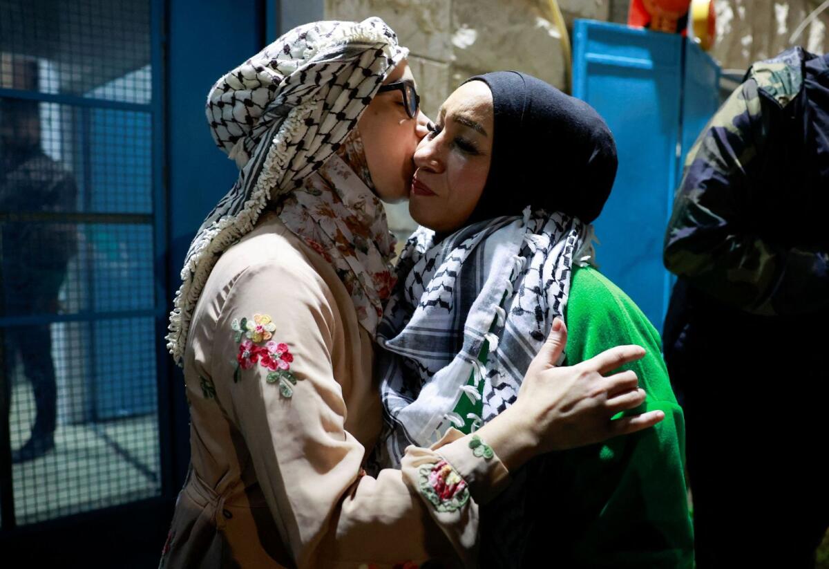A released Palestinian prisoner kisses a loved one as she leaves the Israeli military prison, Ofer. Reuters