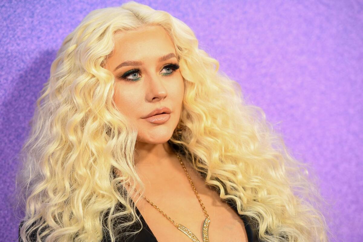 US singer-songwriter Christina Aguilera arrives for the 2022 Billboard Women in Music award at the YouTube theatre at SoFi stadium in Inglewood, California, March 2, 2022. (Photo by Robyn Beck / AFP)