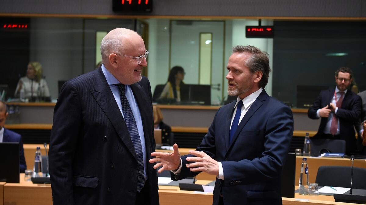 First vice-president of the European Commission in charge of Better Regulation, Inter-Institutional Relations, Frans Timmermans (L) talks with Danish Forein Affairs minister Anders Samuelsen (R) during a meeting at the EU headquarters.-AFP 