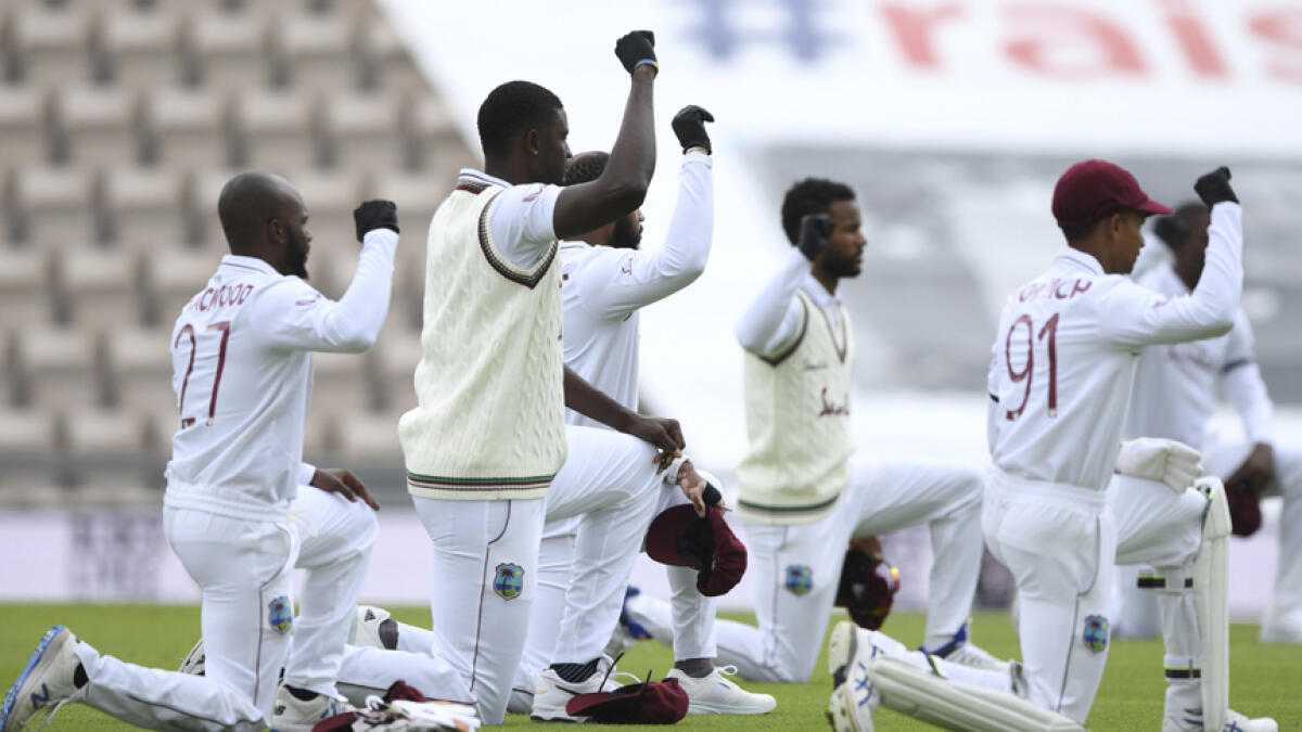 West Indies' cricketers take a knee in support of the Black Lives Matter movement on the first day of the opening cricket Test match against England in Southampton. - AP