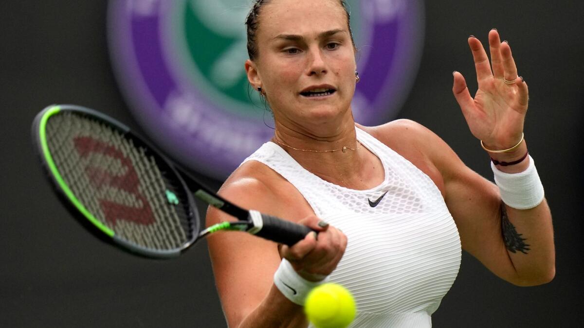Belarus's Aryna Sabalenka returns the ball to Romania's Monica Niculescu during their first round women's singles match on day one of the Wimbledon Tennis Championships in London.— AP