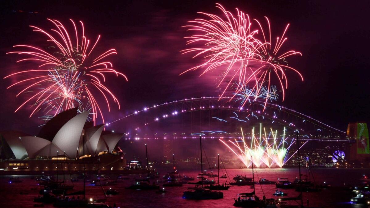 Fireworks explode over the Sydney Opera House and Harbour Bridge as New Year's Eve celebrations begin in Sydney. —AP