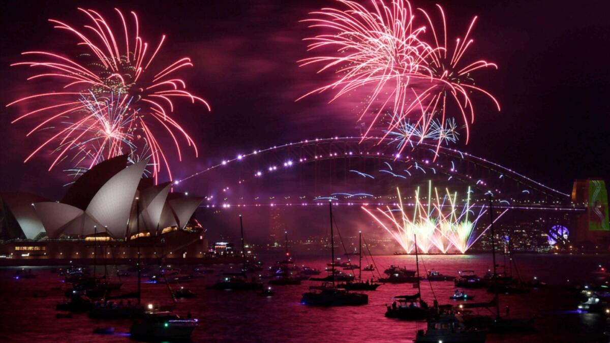 Fireworks explode over the Sydney Opera House and Harbour Bridge as New Year's Eve celebrations begin in Sydney. —AP