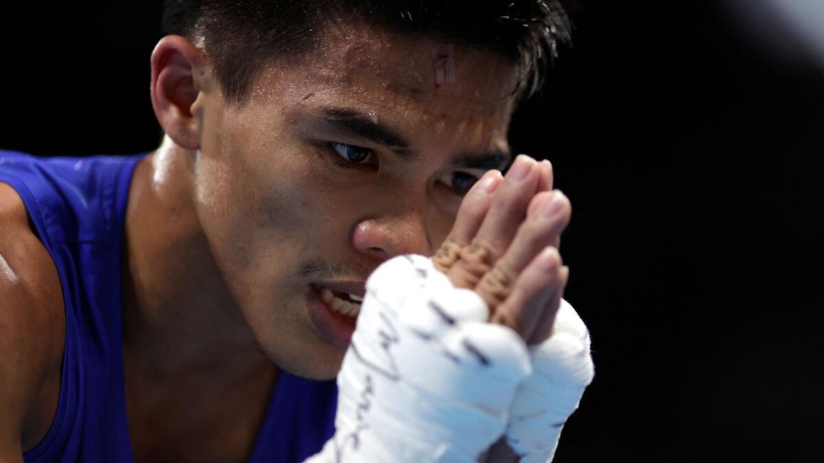 Philippines' Carlo Paalam reacts after winning against Japan's Ryomei Tanaka. (AFP)