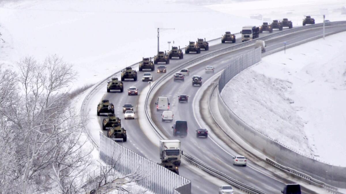 A convoy of Russian armored vehicles moves along a highway in Crimea. — AP