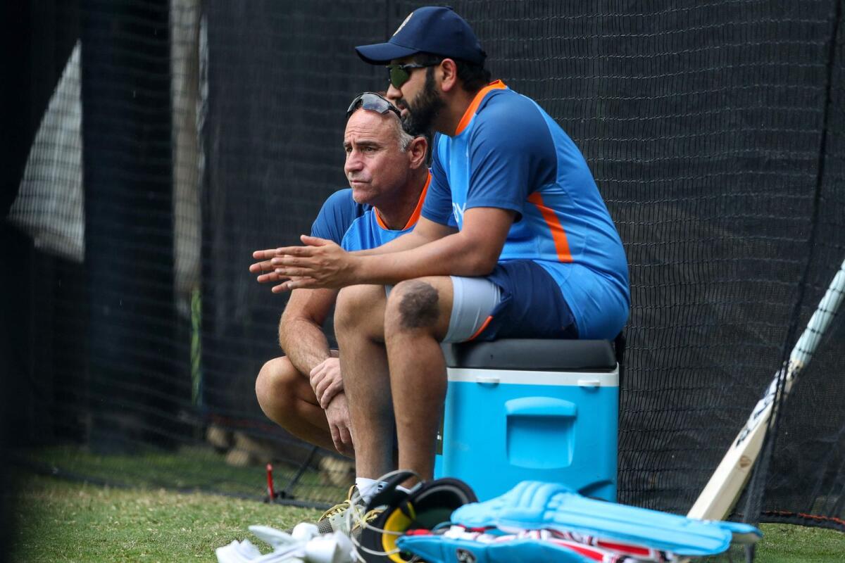 Indian captain Rohit Sharma (right) and mental conditioning coach Paddy Upton during a practice session at the Adelaide Oval on Wednesday. — AFP