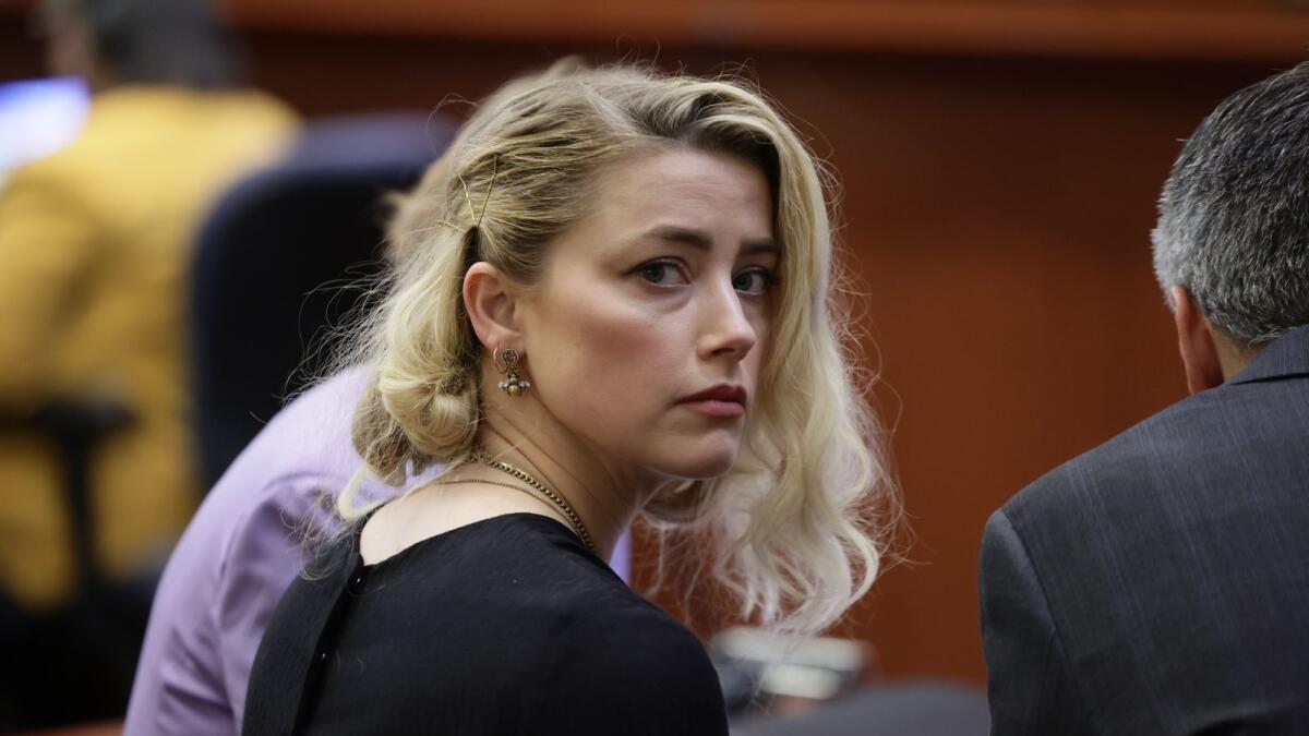 US actress Amber Heard waits before the jury said that they believe she defamed ex-husband Johnny Depp. Photo: AFP