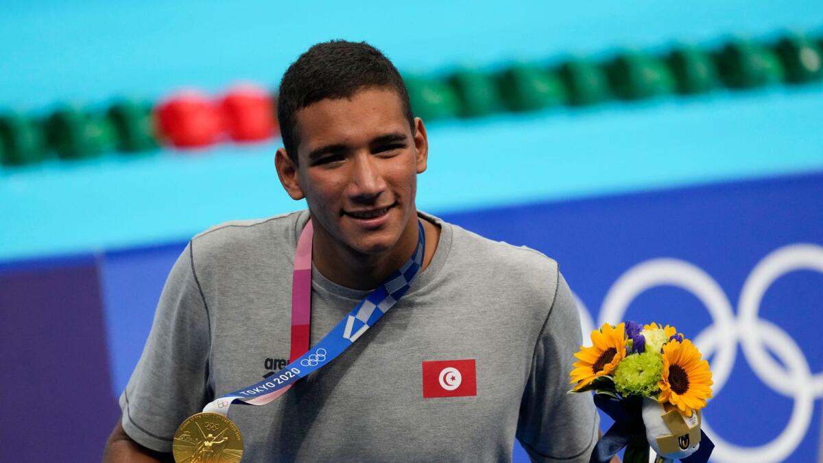 Ahmed Hafnaoui, of Tunisia, celebrates after winning the final of the men's 400-metre freestyle at the 2020 Summer Olympics. — AP