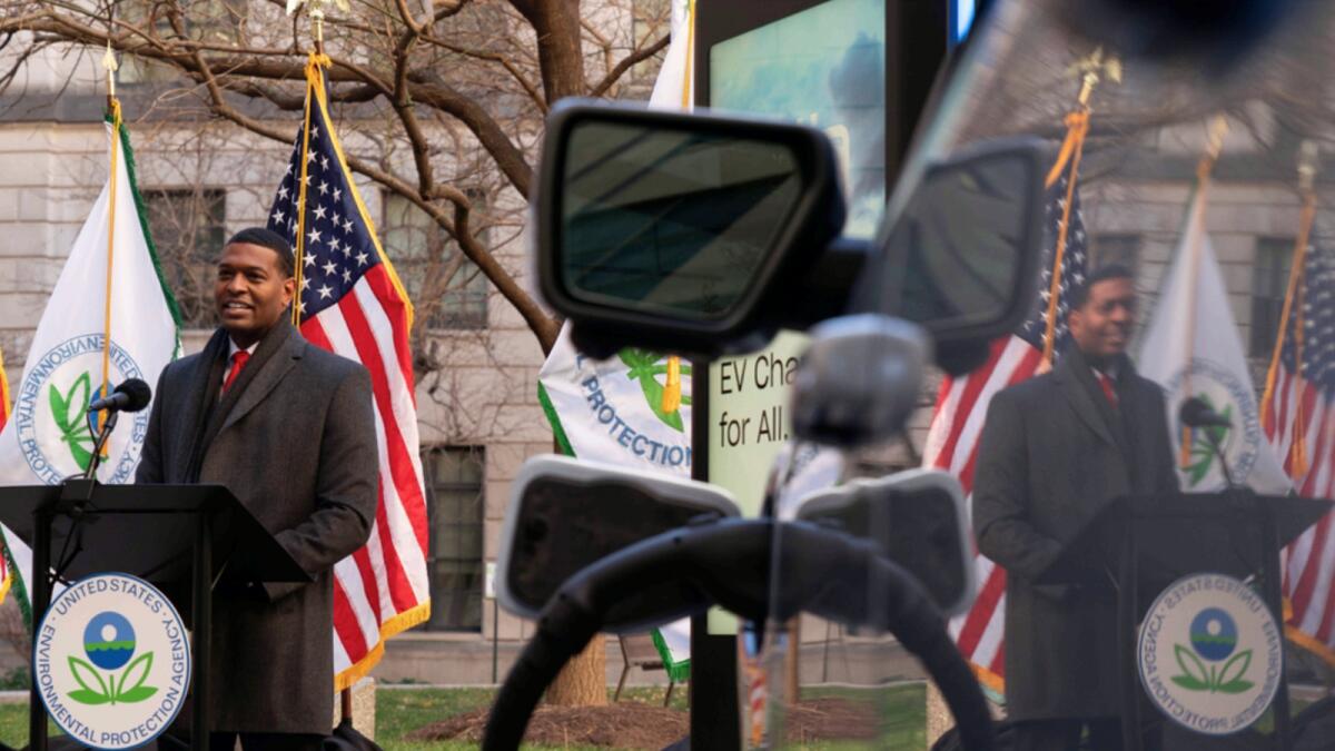 Environmental Protection Agency (EPA) Administrator Michael Regan is reflected in an electronic vehicle as he speaks during an event to announce the Agency's final rule for federal greenhouse gas (GHG) emissions standards for light duty vehicles. — AP