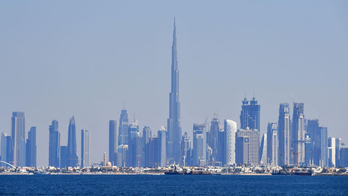 A picture shows the skyline of Dubai with the Burj Khalifa in the background. The UAE GDP is estimated to expand by 5.9 per cent in 2022 and 4.1 per cent this year on the back of the expansion of the non-oil sector.