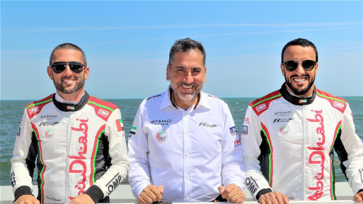 Team Abu Dhabi manager Guido Cappellini with Torrente (left) and Al Qemzi. — Supplied photo