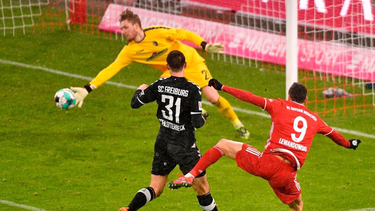 Bayern Munich's Polish forward Robert Lewandowski scores a goal against Freiburg. — AFP