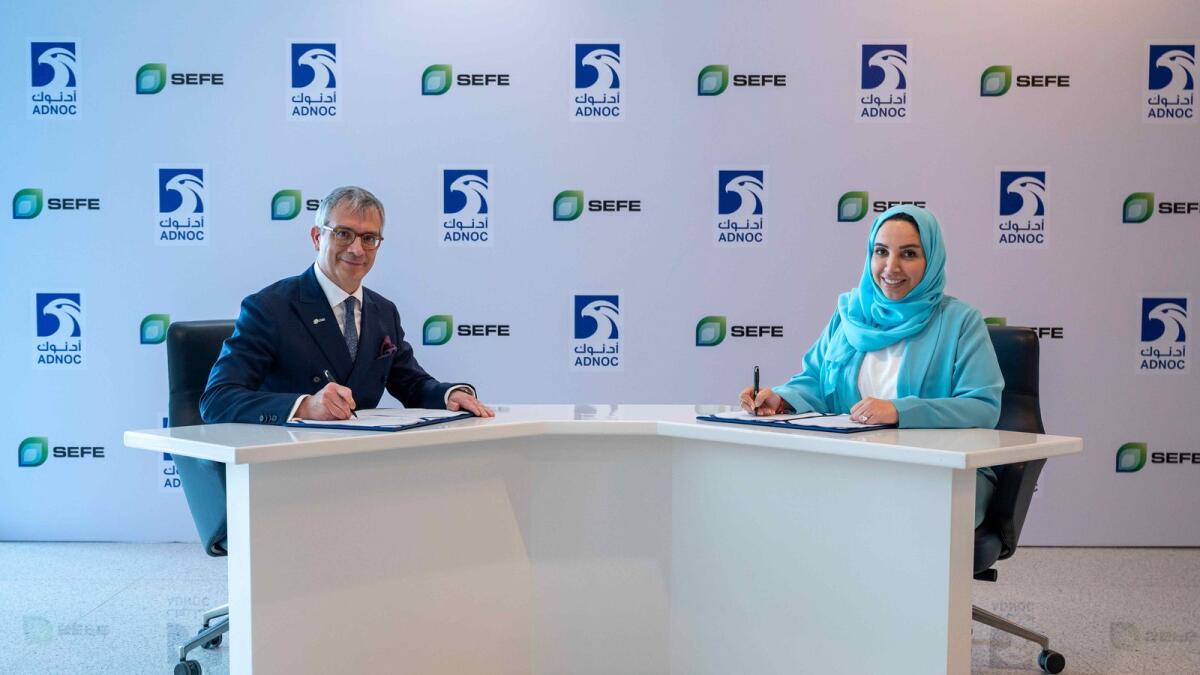 From left: Frédéric Barnaud, CEO, SEFE Marketing &amp; Trading and CCO, SEFE and Fatema Al Nuaimi, EVP, Downstream Business Management, ADNOC, sign the agreement. — Supplied photo