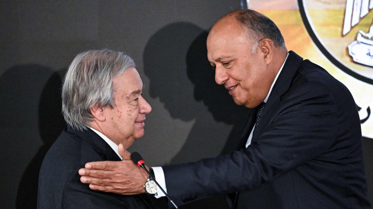 Antonio Guterres and Sameh Shoukry leave the podium after giving a joint press conference following their meeting at the New Administrative Capital east of Cairo. — AFP