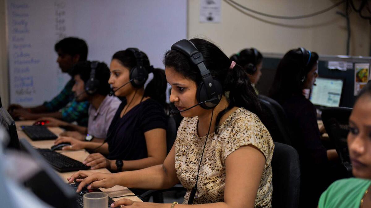 Women work at a call centre in Noida, near India's capital New Delhi. Rollout of 5G services also mean greater innovation and adoption of new-age technology as well. — AFP file