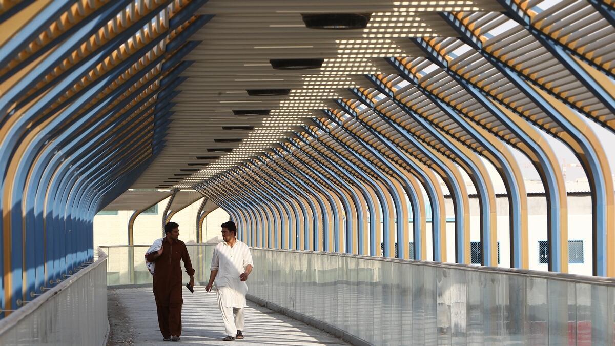 SYMMETRY, BEAMS AND MORE... This pedestrian bridge in Sharjah offers a feast of light and shades.