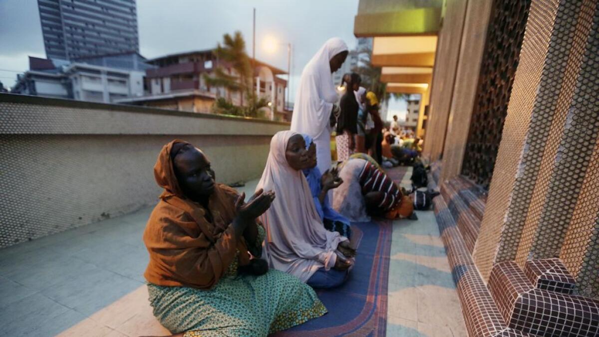 Nigerian Muslims offer prayers on the first day of Ramadan at the central Mosque in Lagos, Nigeria, Monday, June 6, 2016.