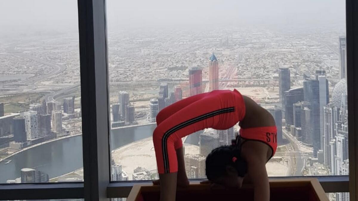 Dubai girl, smashes, another, yoga world record, Burj Khalifa