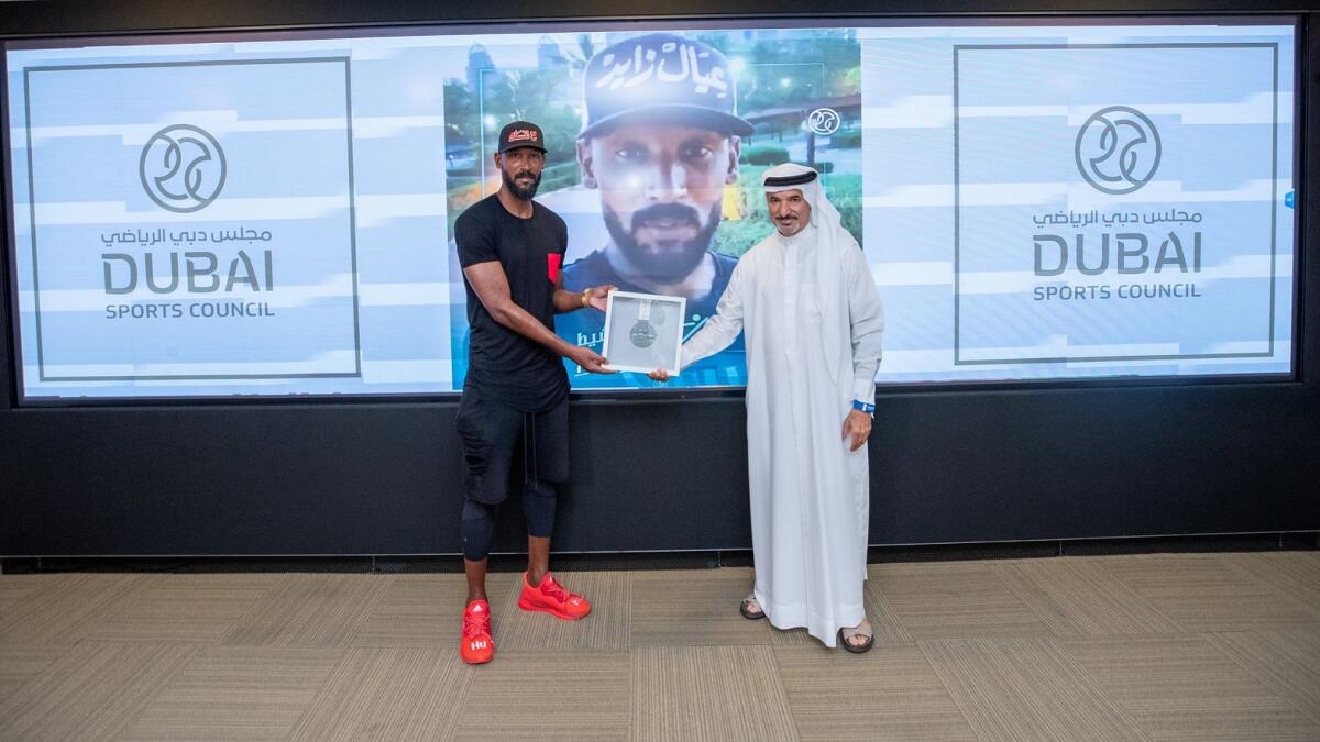 Nicolas Anelka receives the award from Saeed Hareb.— Supplied photo