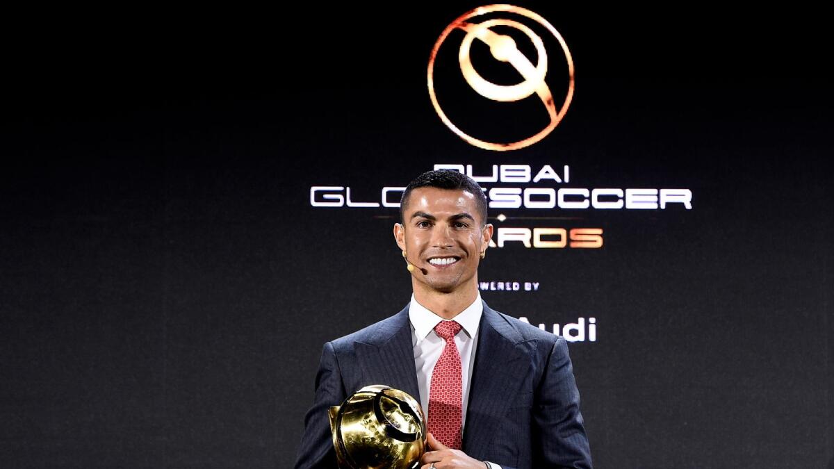 Cristiano Ronaldo with the Player of the Century award. (Supplied photo)