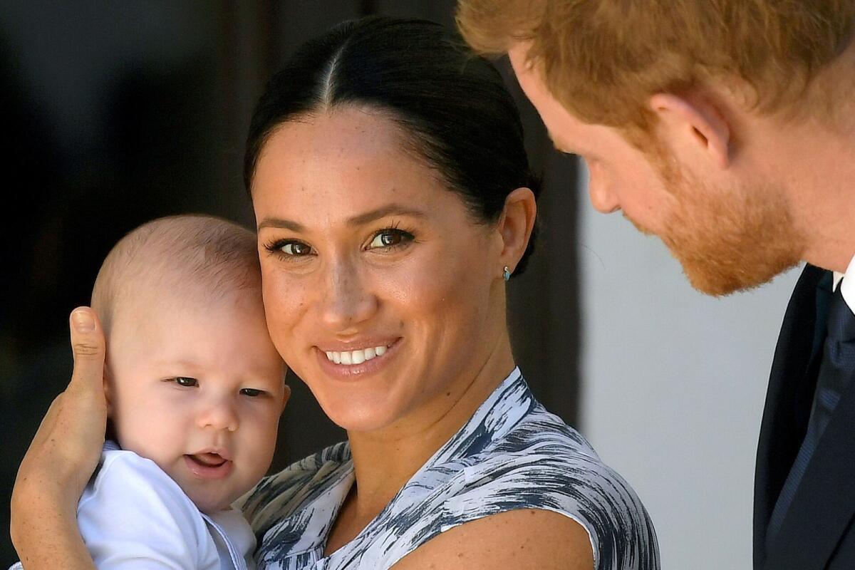 Meghan Marklewith son Prince Archie and husband Prince Harry