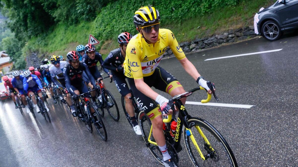 UAE Team Emirates' Tadej Pogacar of Slovenia wearing the overall leader's yellow jersey leads the pack during the 9th stage of the 108th edition of the Tour de France cycling race. — AFP