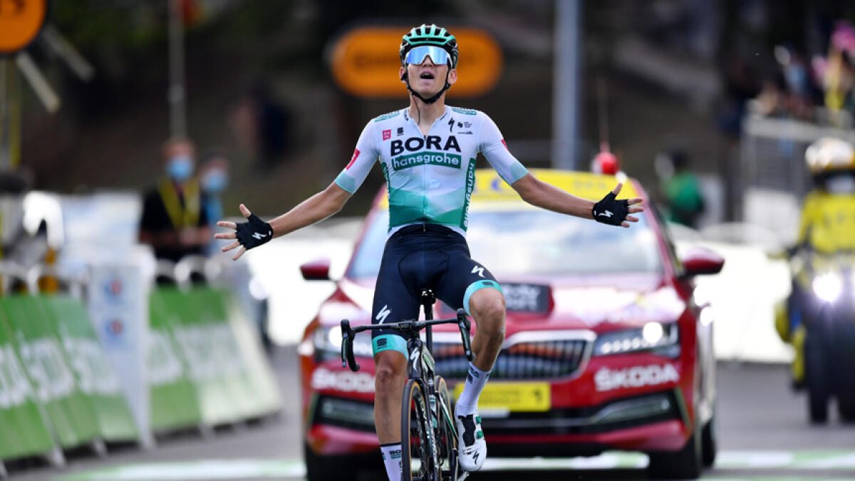 BORA-Hansgrohe rider Lennard Kamna of Germany celebrates after winning the 16th stage. - Reuters