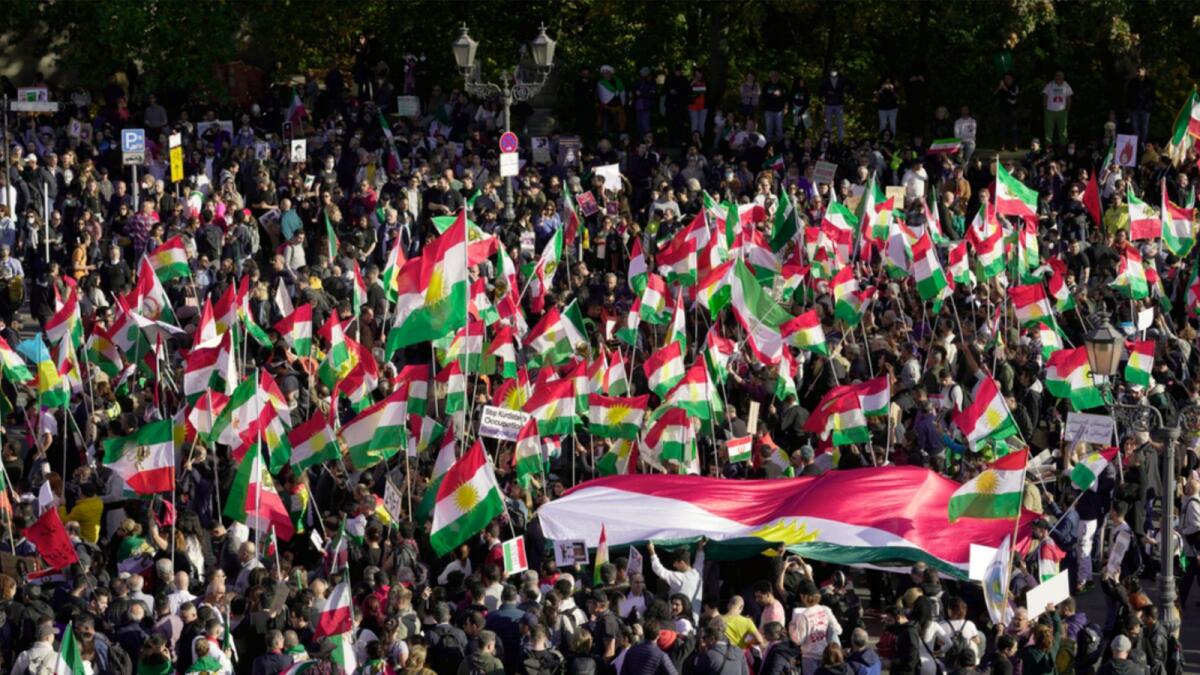People attend a protest against the Iranian regime, in Berlin. — AP