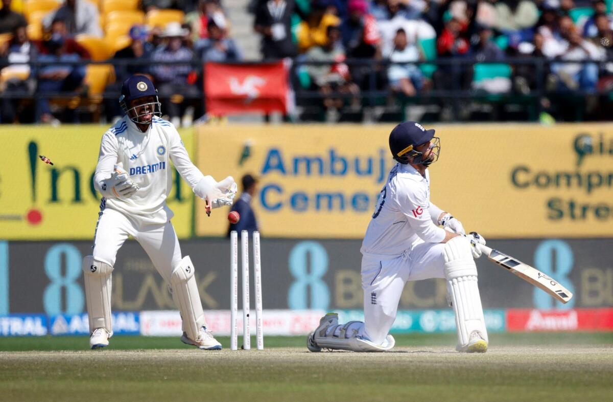 England's Ben Foakes is bowled out by India's Ravichandran Ashwin (not in pic). - Reuters