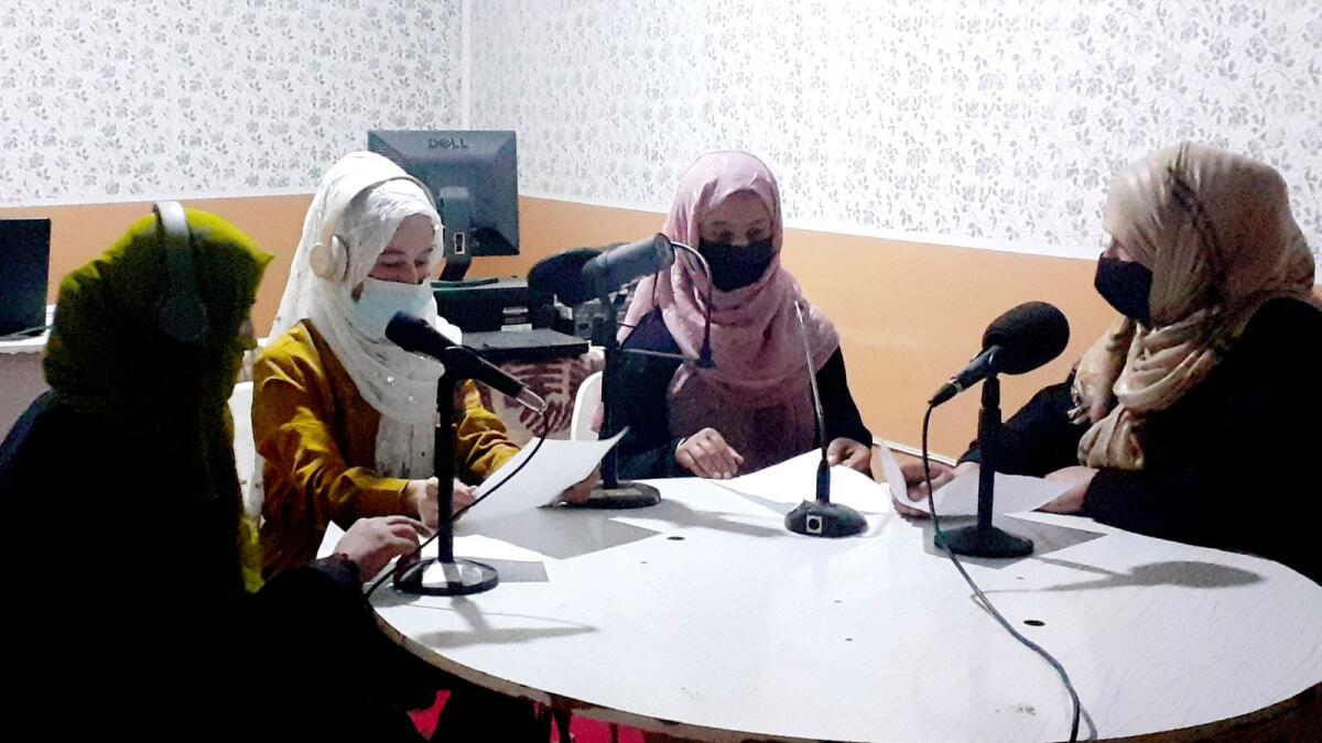 Najia Sorosh, head of Sadai Banowan, a women-run radio station, right, speaks with her staff in the broadcasting studio in Badakhshan province, north-eastern of Afghanistan, on  March 7, 2023. — AP