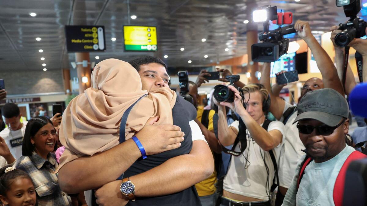 Muhammad Williams greets his mother, Fowzia Williams on his arrival back home at Cape Town International Airport after he was evacuated from Sudan to escape the conflict, in Cape Town, South Africa. — Reuters